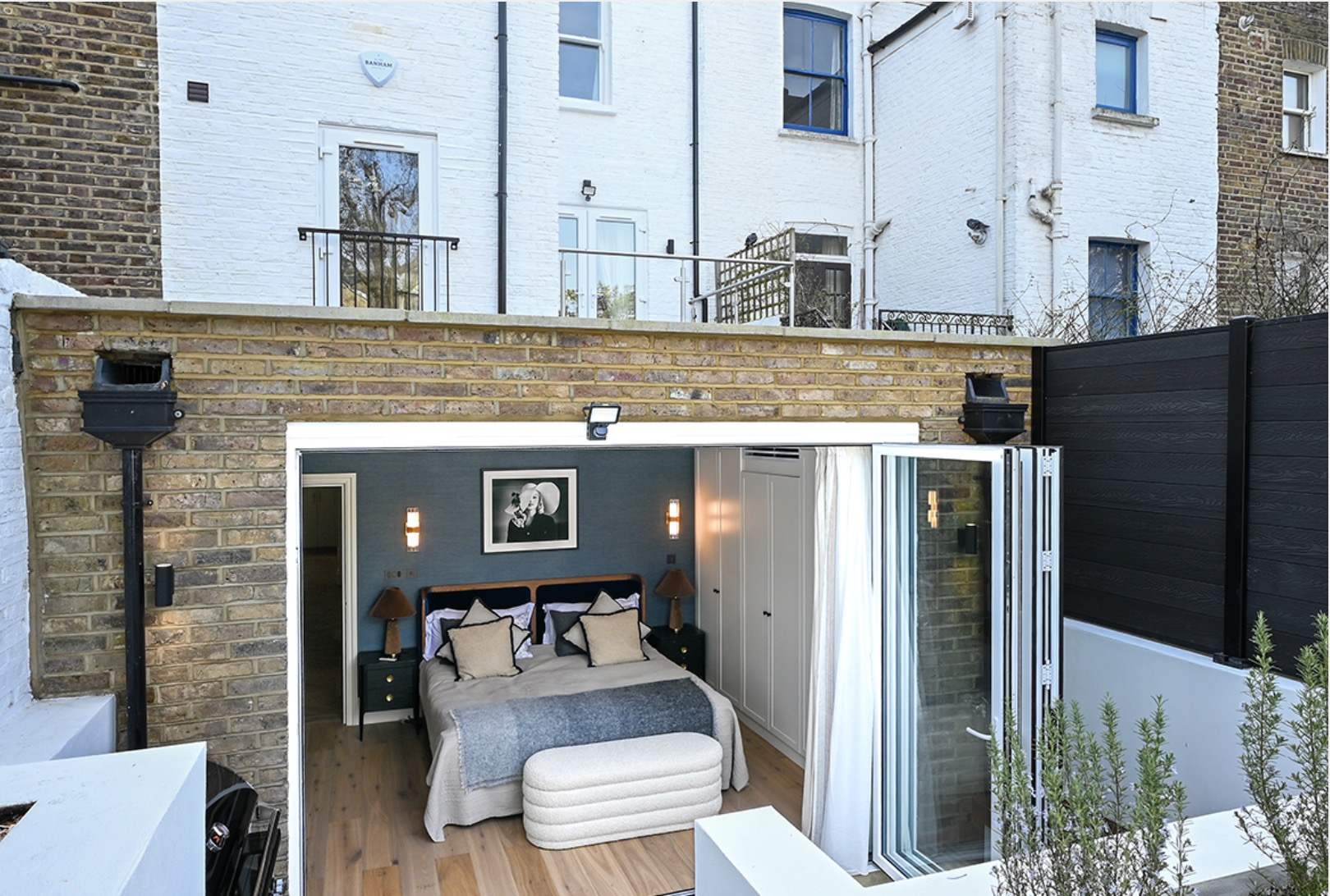 Dawes Road lower-ground bedroom opening onto private courtyard